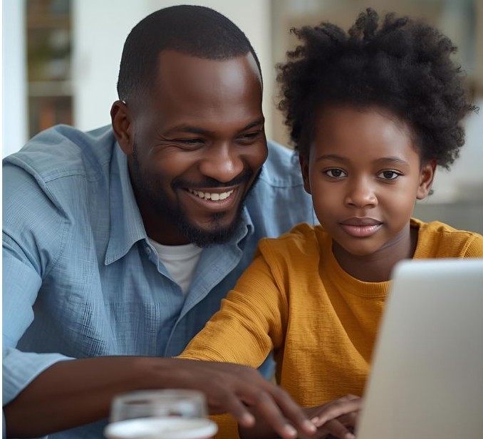 Parent supporting child during Dimacious online learning session.